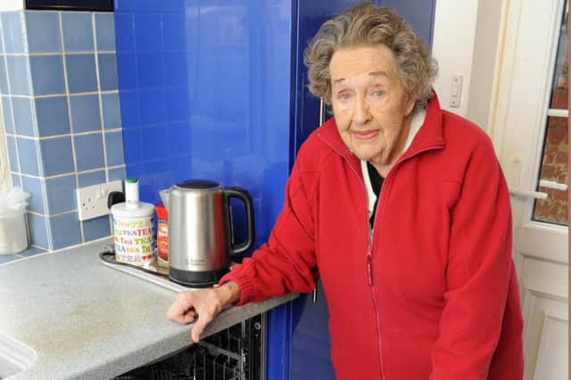 Rita Leist at her Southsea home with the Hotpoint Dishwasher that has caused her so much concern Picture: Malcolm Wells