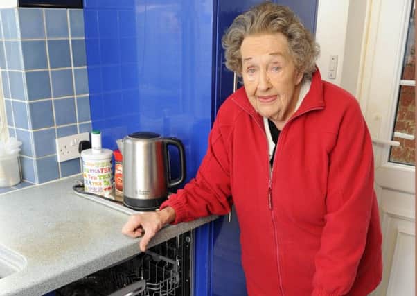 Rita Leist  at her Southsea home with the Hotpoint Dishwasher that has caused her so much concern     Picture: Malcolm Wells