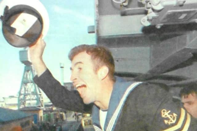 Leading WEM Phil Phillips, from Fareham, waves to his wife, Lynne, in the crowd as HMS Liverpool returns home after seven months on duty