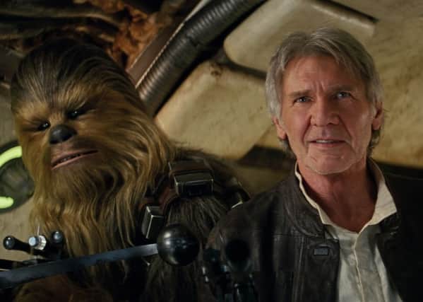 Chewbacca (Peter Mayhew) and Han Solo (Harrison Ford) Film Frame

Â©Lucasfilm 2015