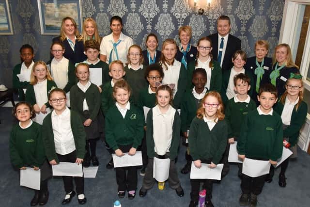 Fernhurst Junior School choir with representatives of McCarthy and Stone. Back, from left: Vanesssa Simpson, Karen Lewer, Catherine Tweedley, Shelley Crickett, Samantha Weller, Neil Copping. Gillian Williamson and Rebecca Pritchard