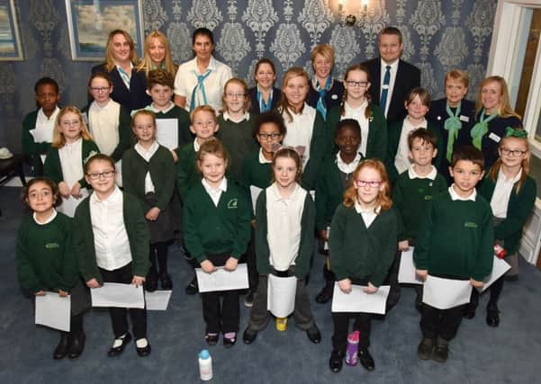 Fernhurst Junior School choir with representatives of McCarthy and Stone. Back, from left: Vanesssa Simpson, Karen Lewer, Catherine Tweedley, Shelley Crickett, Samantha Weller, Neil Copping. Gillian Williamson and Rebecca Pritchard