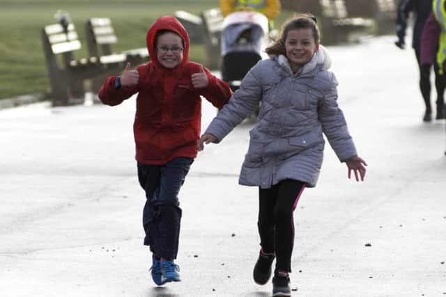 Pearson Atkinson and Tanisha Gray. Stokes Bay junior parkrun takes place on Sundays. Picture: Neil Marshall (171348-30)