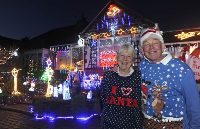 Bill and Barbara Wright who have decked out their home in Portchester in thousands of christmas lights to raise money for Queen Alexandra Hospital     
Picture Ian Hargreaves  (171683-1)