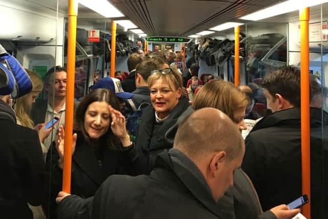 Commuters ride a crowded South Western Railway train on the Portsmouth to London line. Picture: Carey Tompsett/PA Wire
