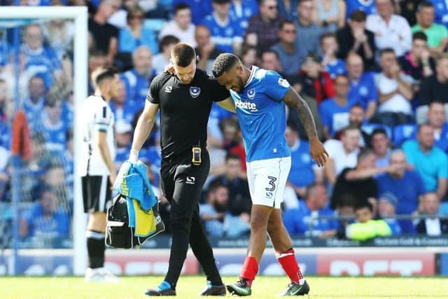 Tareiq Holmes-Dennis limps off in the opening match of the season. Picture: Joe Pepler