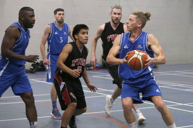 Steve Davison in possesion of the ball for Portsmouth RN Smugglers. Picture: Habibur Rahman