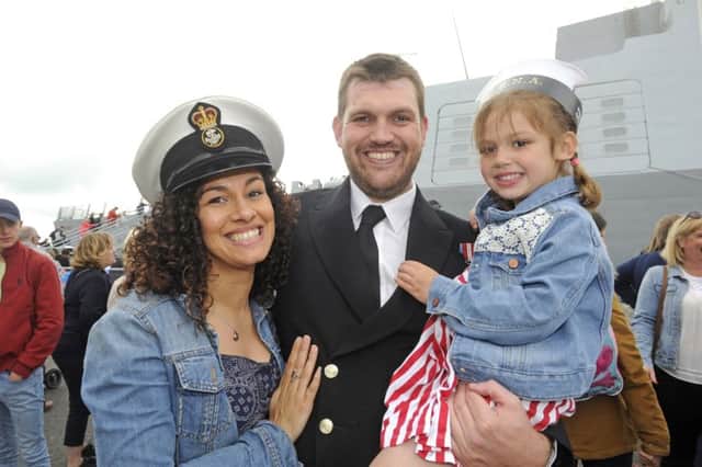 HMS Daring returned to Portsmouth Naval Base following a recent nine-month deployment to the Middle East. Here Charlotte Lewis greets her husband PO Richard Lewiswith their daughter Maisie              Picture  Ian Hargreaves  (170611-1)
