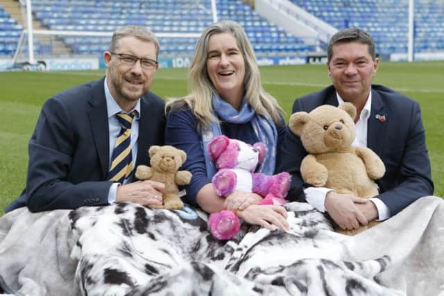 Mark Waldron, editor of The News, with  Clare Martin from Pompey in The Community and Mark Catlin from Portsmouth Football Club, preparing to sleep out on the grounds of Portsmouth Football Club for the Pomoey CEO Sleepout     Picture :  Habibur Rahman