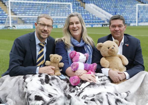 Mark Waldron, editor of The News, with  Clare Martin from Pompey in The Community and Mark Catlin from Portsmouth Football Club, preparing to sleep out on the grounds of Portsmouth Football Club for the Pomoey CEO Sleepout     

Picture :  Habibur Rahman