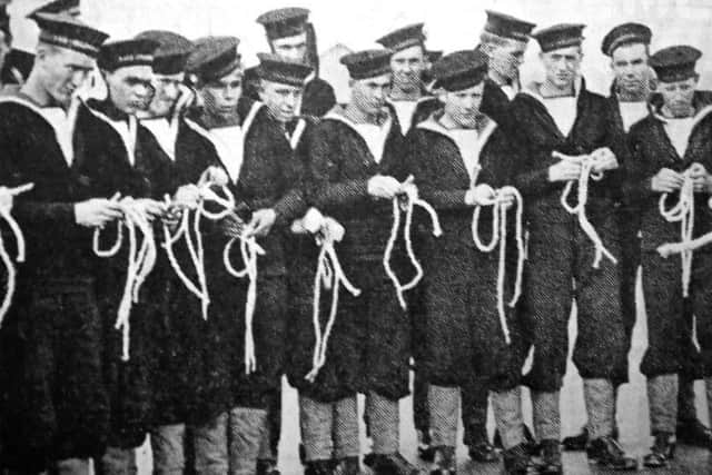 New entrants into the Royal Navy are being taught how to tie knots at HMS Collingwood, Fareham, in November 1940.