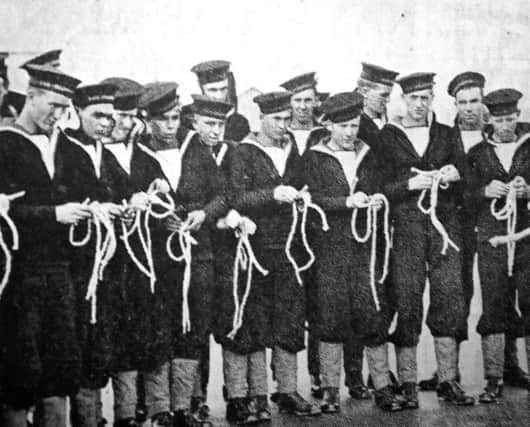New entrants into the Royal Navy are being taught how to tie knots at HMS Collingwood, Fareham, in November 1940.