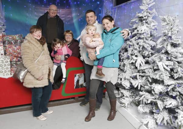 A family enjoy the sleigh ride at Keydell Nurseries Picture: Habibur Rahman