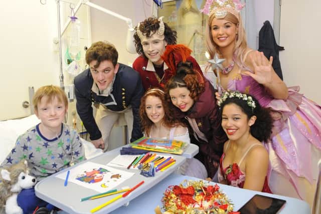 The cast of Beauty and the Beast visit Sam Merrick, aged 9, from Denmead at Queen Alexandra Hospital
Picture by: Malcolm Wells
