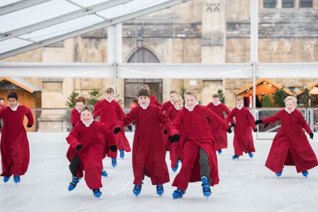 Choristers on the ice in the precincts of Winchester Cathedral Picture: Nicky Pascoe