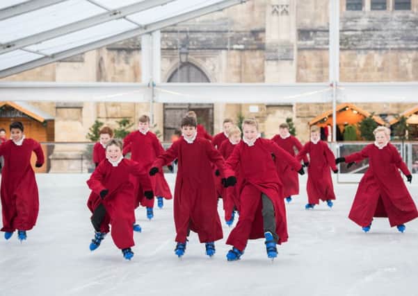 Choristers on the ice in the precincts of Winchester Cathedral Picture: Nicky Pascoe