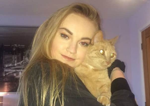 Esme Vine, 15, with Millie the cat