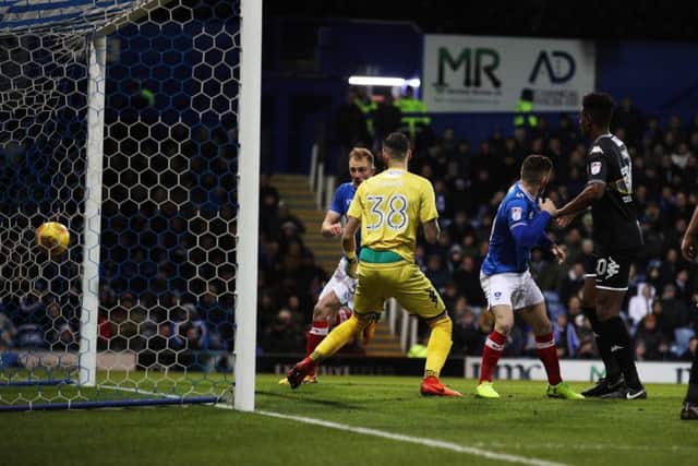 Matt Clarke scores Pompey's winner against Bury Picture: Joe Pepler
