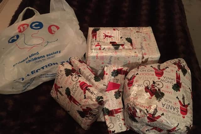 The presents, alongside the bag they fell from the car in. Picture: Cathy John