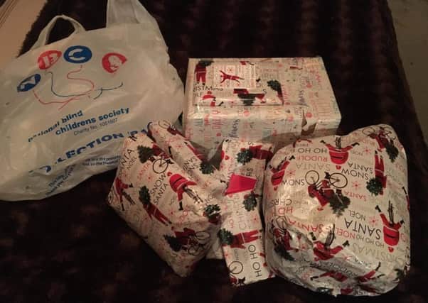 The presents, alongside the bag they fell from the car in. Picture: Cathy John