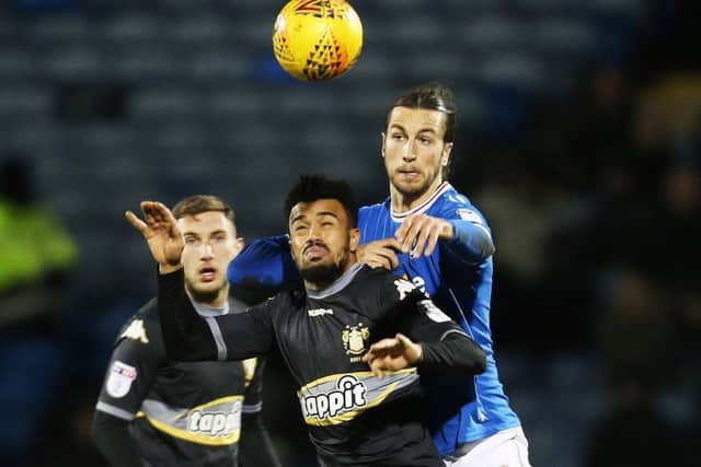 Christian Burgess in action against Bury. Picture: Joe Pepler