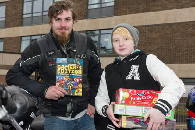 'Stig' Phipps and Summer Robinson with their donations
Picture: Duncan Shepherd
