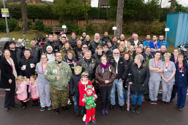 Members of the 'Family Motorcyle Group' along with 'Portsmouth Scooterists' join staff from the A&E unit at QA Hospital Picture: Duncan Shepherd