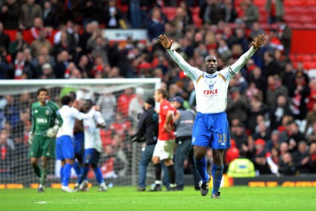 Sol Campbell celebrates after the win at Old Trafford.  Picture: Steve Reid