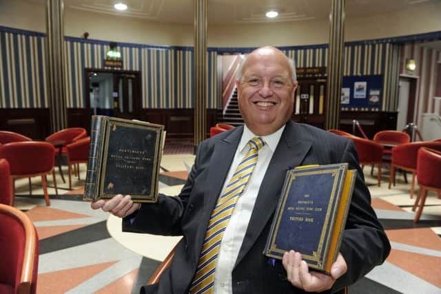 John Alderson, the general manager of the Royal Maritime Club, is delighted to have the club's two historical visitors books returned, having been stolen three years previously. They include the signatures of Queen Victoria and the present day Queen              Picture Ian Hargreaves  (170734-1)