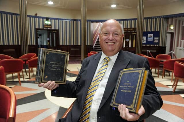 John Alderson, the general manager of the Royal Maritime Club, is delighted to have the club's two historical visitors books returned, having been stolen three years previously. They include the signatures of Queen Victoria and the present day Queen              
Picture Ian Hargreaves  (170734-1)