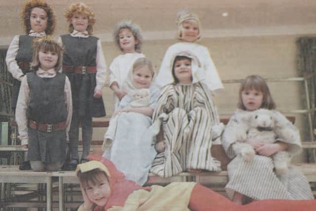 Children at Portsmouth Junior High School celebrate Christmas