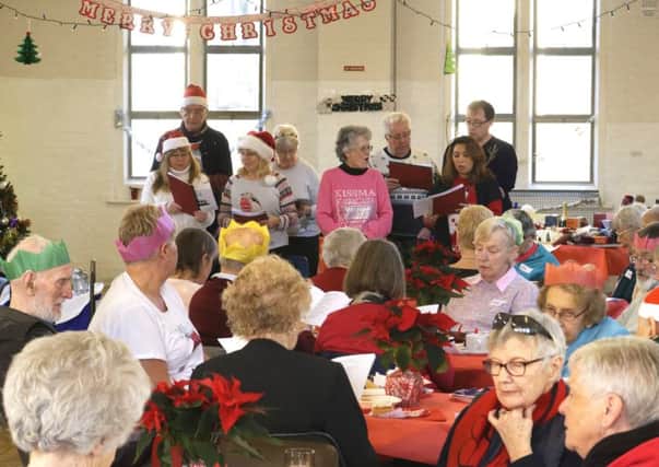 Carol singing at the Eastney and Milton Neighbourhood Police team'sChristmas party for the elderly and vulnerable people of Portsmouth at St Swithuns Church Hall, Waverley Rd, Southsea.

Pictures: Neil Marshall (171725-16)