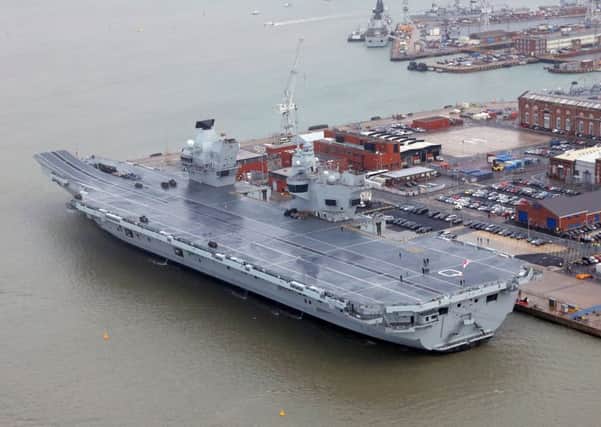Pictured is the commissioning of HMS Queen Elizabeth at HMNB Portsmouth. Her Majesty the Queen formally commissioned her namesake aircraft carrier, HMS Queen Elizabeth into the Royal Navy fleet. Dec 7, 2017. PPP-170712-140559001