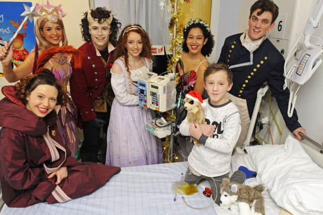 The cast of Beauty and the Beast visit Jude Allen, aged 7, from Cowplain
Picture by: Malcolm Wells