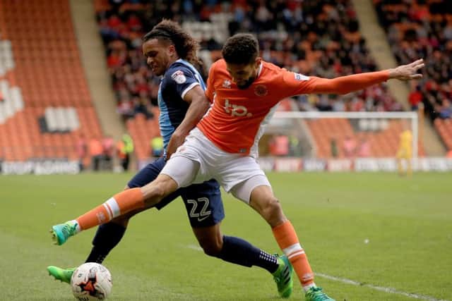 Blackpool's Kelvin Mellor, battles Sandro Semedo for the ball