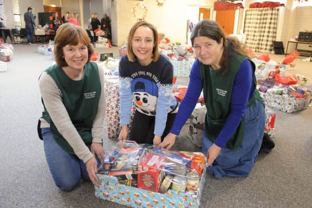 From left, Sue Ellis ,Debbie Darke and Chris Westcott with one of the last food boxes ready to be collected from the Waterlooville food bank this week
Picture: Malcolm Wells (171219-1365)