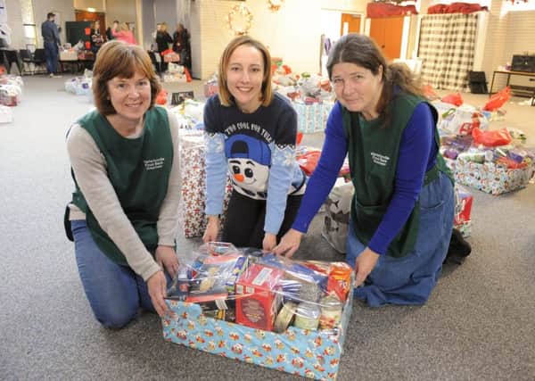 From left, Sue Ellis ,Debbie Darke and Chris Westcott with one of the last food boxes ready to be collected from the Waterlooville food bank this week 

Picture: Malcolm Wells (171219-1365)