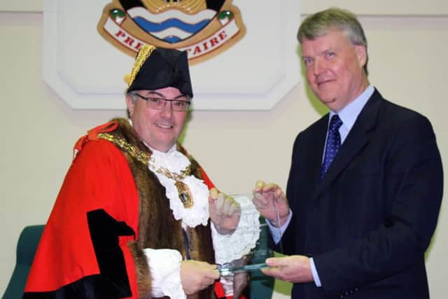 Councillor Woodward presenting the award to Mayor of Fareham Councillor Geoff Fazackarley