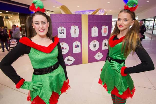 Two festive elves are on hand to help shoppers stuck for ideas as part of the Giftspiration campaign at Cascades Shopping Centre
