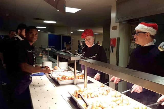 Christmas dinner is served at HMS Sultan