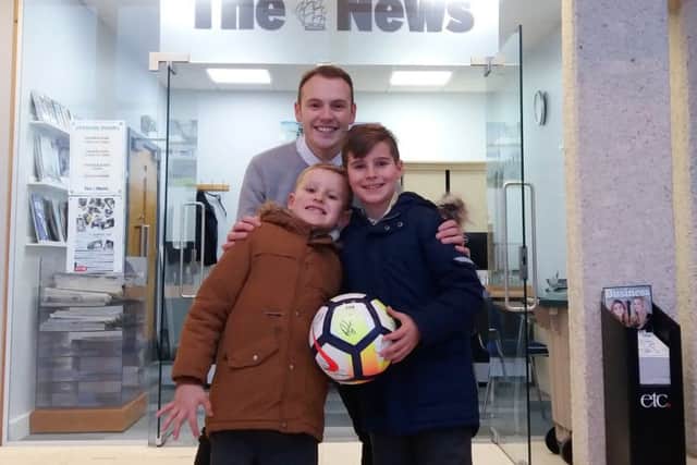 Scott Moret's step sons Lewis and Oliver Hook collect the prize from sports writer Will Rooney