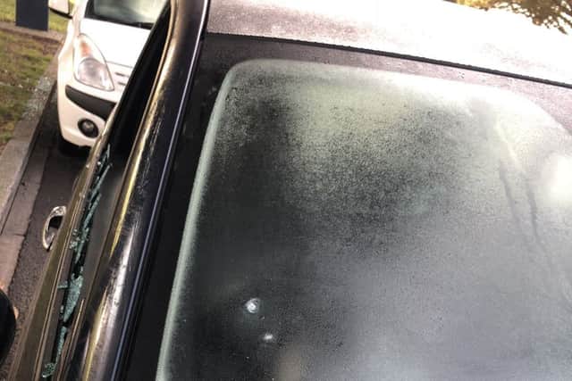 Another of the damaged cars