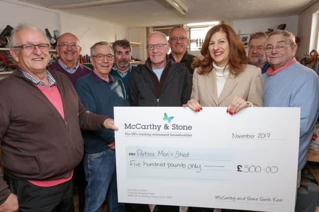 McCarthy and Stone area sales manager Nina Fitzgerald presents the cheque to Portsea Men's Shed. Picture: Andrew Williams.