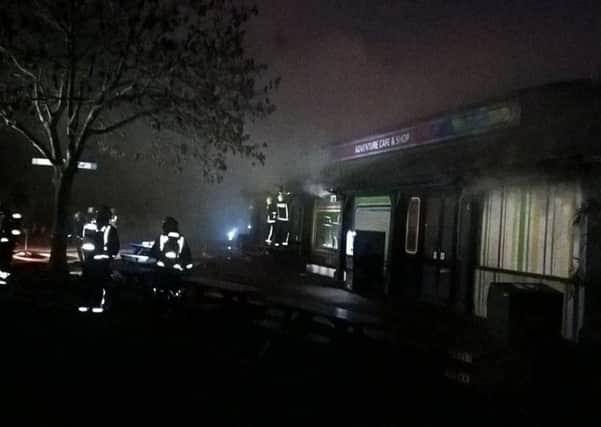 Smoke billows out of London Zoo's Adventure Cafe and Shop. Credit:  London Fire Brigade/PA Wire