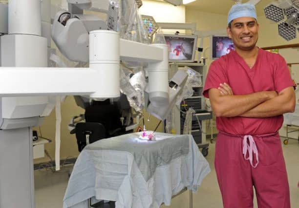 Surgeon Jim Khan with the Da Vinci Robot in QA Hospital. Picture: Ian Hargreaves  (132761-4c) PPP-171003-134011001