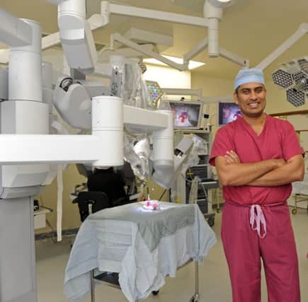 Surgeon Jim Khan with the Da Vinci Robot in QA Hospital. 
Picture: Ian Hargreaves  (132761-4c) PPP-171003-134011001