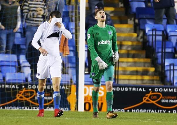 Pompey's Luke McGee dejected after a mistake that led to the opening goal during their League One match at Shrewsbury Town. Picture: Joe Pepler/Digital South