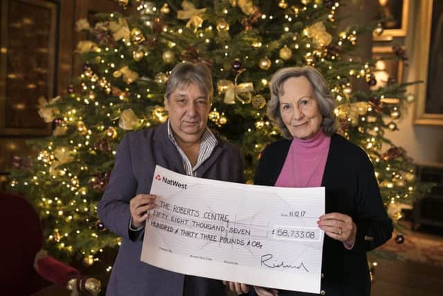 Her Grace Susan Duchess of Richmond, right, presented a cheque for £58,733 to Carole Damper, chief executive of the Roberts Centre in Portsmouth Picture: Nicole Hains