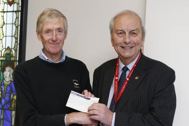 Derek Gillard donating Â£15,000 to Mick Lyons of Rocky Appeal to keep the Da Vinci robot at Queen Alexandra HospitalPicture: Habibur Rahman
