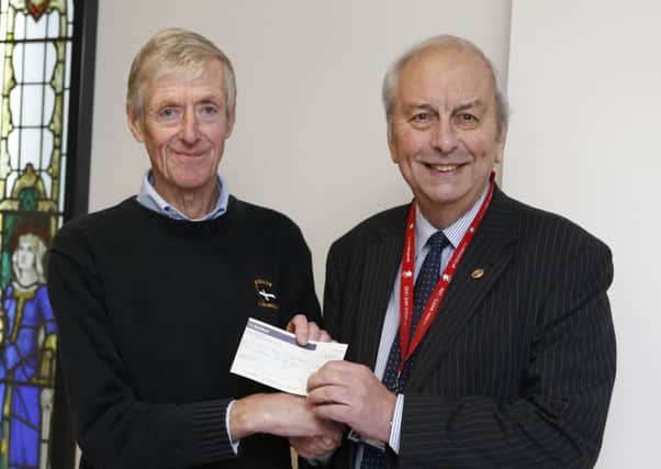 Derek Gillard donating Â£15,000 to Mick Lyons of Rocky Appeal to keep the Da Vinci robot at Queen Alexandra Hospital

Picture: Habibur Rahman